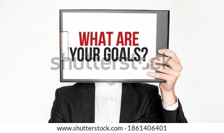 Show wait word on paper shown by business man isolated on white background. Text What Are Your Goals