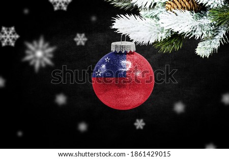 Happy new Year 2021, flag of Samoa on a christmas toy, decorations isolated on dark background. Creative christmas concept.