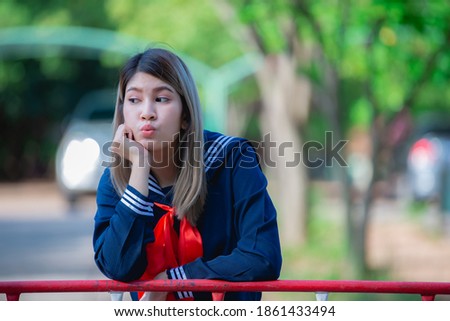 Portrait of asian woman wear student dress japan style,Thailand people,Cute girl pose for take a picture,Lifestyle of modern woman