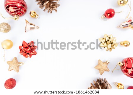 Top view of Christmas elements , pine cone, red ball, ribbon, stars glitter, gold ball, bells on white background.