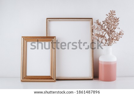 Set of two gold picture frames with decorations. Mockup for individual design, text. Copy space. Rose gold, pastel, soft colors. Frame mock-up.
