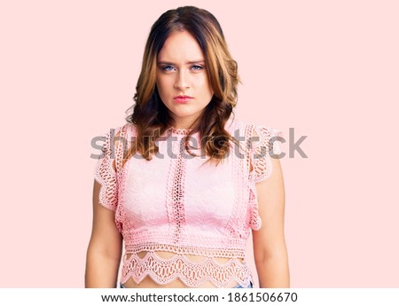 Young beautiful caucasian woman wearing casual clothes skeptic and nervous, frowning upset because of problem. negative person. 