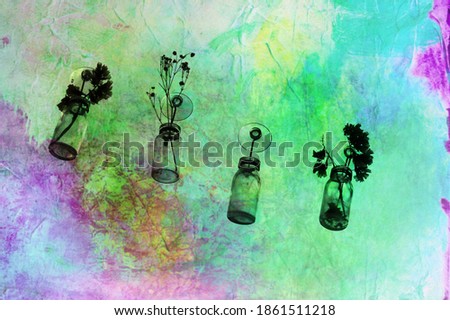 Silhouette of some small flowers hanging from a window  in a blue and purple fantasy background.