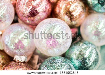 Glass Christmas balls with glitters, sparkles, close up, soft focus