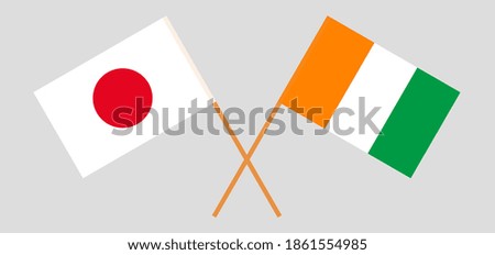 Crossed flags of Japan and Republic of Ivory Coast
