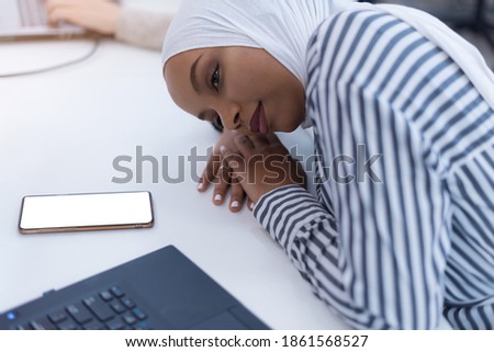 African muslim  businesswoman feeling unwell suffering from headache migraine touching forehead during work, upset black woman employee frustrated by business problem or work stress, head shot