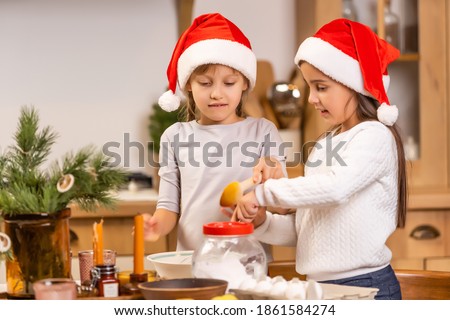 kids baking christmas cookies before the celebration of Christmas. Family