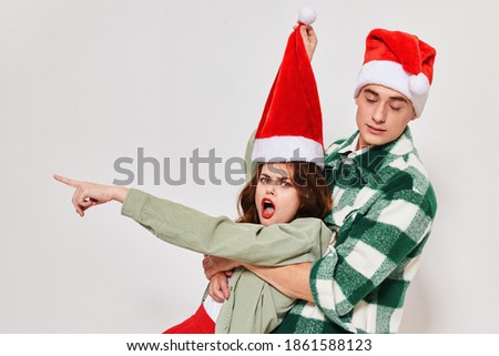 emotional young couple christmas hats holiday friendship togetherness lifestyle