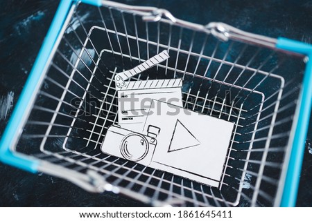 creative content sold online conceptual image, photo and video digital downloads icon in shopping basket 