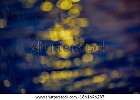 Awe beautiful vibrant cyan shallow moonlight night path of round highlights spot particles on wet misty backwater area. Close-up view with space for text on fresh blur spa pool. Spring travel scene