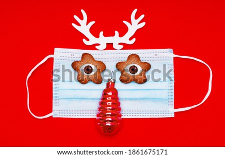 medical mask with deer antlers on a red background
