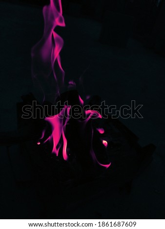 uttarakhand,india-3 may 2020:flames in dark.burning wood in dark.this is a picture burning wood in dark.fire is made for winters.