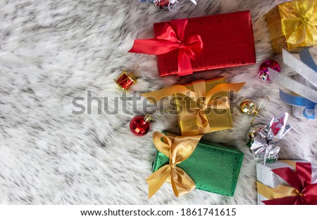 Top view christmas gift boxes on rug with copy space background, Merry christmas greeting card, birthday and new year concept