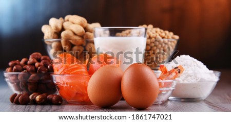 Composition with common food allergens including egg, milk, soya, peanuts, hazelnut, fish, seafood and wheat flour Royalty-Free Stock Photo #1861747021