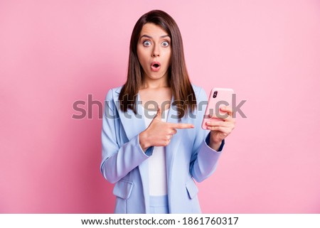 Photo of young lady amazed shocked surprised point finger cellphone mobile advert isolated over pastel color background