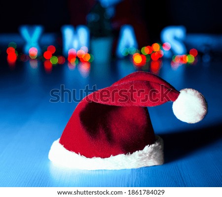 Santa Claus hat close-up. colorful picture. new year concept. on the background of the inscription xmas