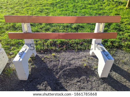 broken park bench at daytime closeup photo