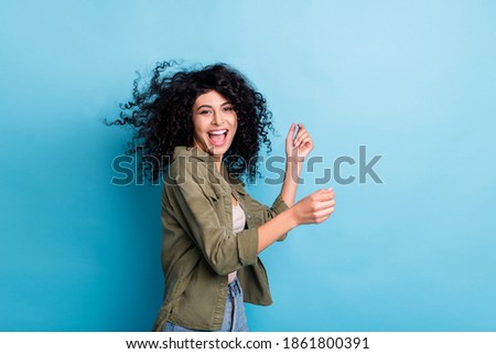 Photo of funny excited person enjoy dancing open mouth hair flying isolated on blue color background Royalty-Free Stock Photo #1861800391
