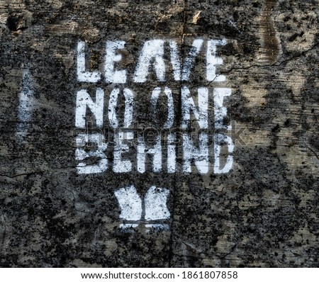 Leave no one behind graffito Royalty-Free Stock Photo #1861807858