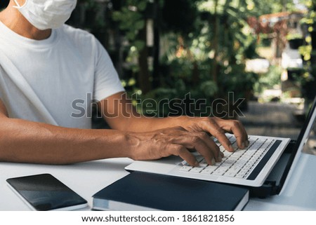 A man working at home and using laptop on the table. Technology and business concept.