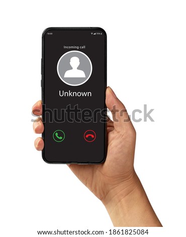 Hand holding the black smartphone with Unknown incoming call. Royalty-Free Stock Photo #1861825084