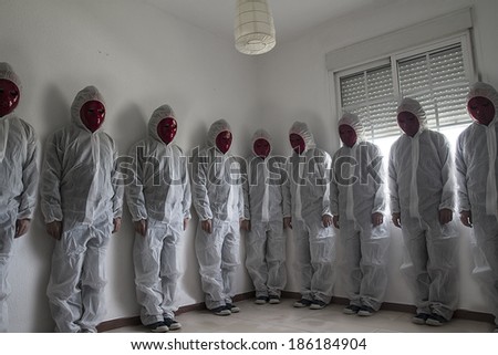Nightmare concept, man with white dress and red mask