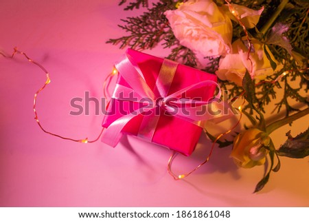 gift boxes with roses. neon lights