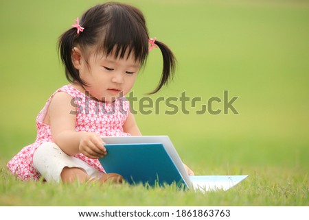 Image of a girl reading a book