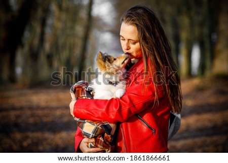 Portrait girl with pet. The dog kissing his owner