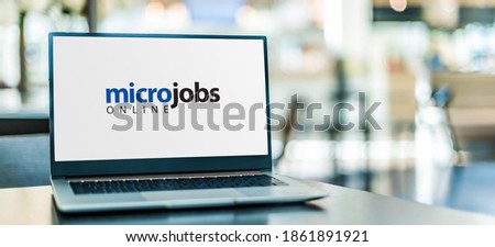Laptop computer displaying the sign "micro jobs online"
