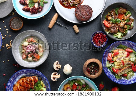 table food top view. Set of dishes on the table. international mix set foods. vegeterian and meat and raw Royalty-Free Stock Photo #1861900132