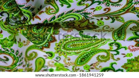 Paisley green pattern on a white background. Although the pinecone or almond shape is of Persian origin, the English name for the paintings comes from the town of Paisley in the west of Scotland.