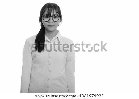Portrait of young beautiful Asian teenage girl with eyeglasses