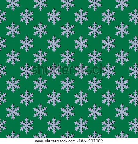 Christmas pattern. Wooden white snowflake on a green background. Repeating white snowflakes on a green background. Abstract Christmas background.