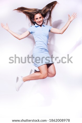 young pretty teenage girl jumping cheerful isolated on white background, lifestyle people concept
