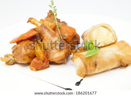 rabbit stew with mushroom sauce and cheese rolls