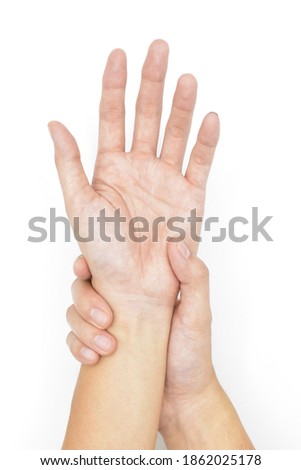 Asian young man’s wrist joint and hand. Concept of joint problems and hand health. Isolated on white.
