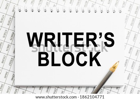 Notepad with inscriptions WRITER'S BLOCK on a white background. business concept.
