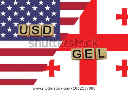 American and Georgian currencies codes on national flags background. USD and GEL currencies