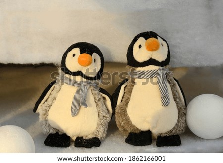 two penguins figures made of fabric
