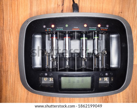 Status display of the home Ni-Mh battery, means accumulator charger. Economic and ecological replacement of alkaline batteries. It saves nature.