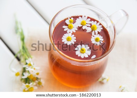 herbal tea with chamomile on a wooden table