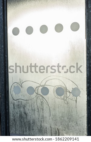 Frost condesation on glass wall at a bus stop