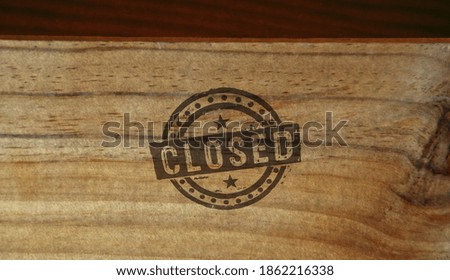 Closed stamp printed on wooden box. Bankruptcy and business close concept.