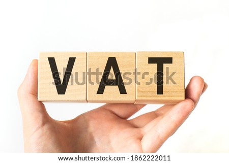Word vat. Wooden small cubes with letters isolated on white background with copy space available.Business Concept image.