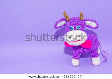 violet cow on the violet background