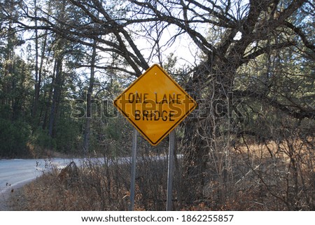 Yellow Metal One Lane Bridge Sign In Forest Of South Dakota