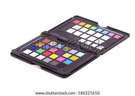 Close up view of color checker equipment of professional photographer for adjust and balance photograph, isolated on white background.