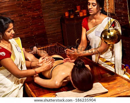 Young woman having Ayurveda spa treatment.