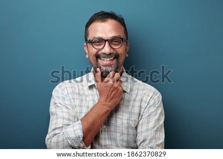 Smiling face of a man of Indian origin Royalty-Free Stock Photo #1862370829
